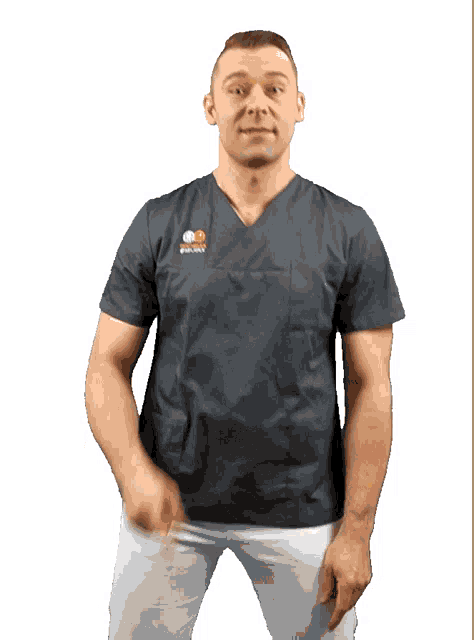 a man wearing a scrub top that says " polska " on it