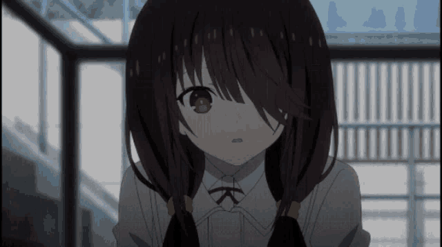 a girl with red eyes and a white shirt with the letter k on it