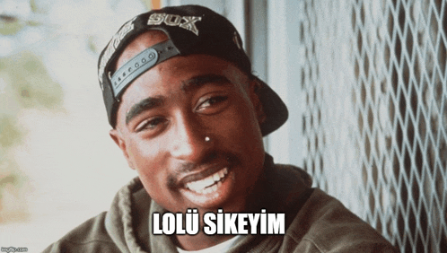 a man wearing a sox hat is smiling with the caption lolu sikeyim