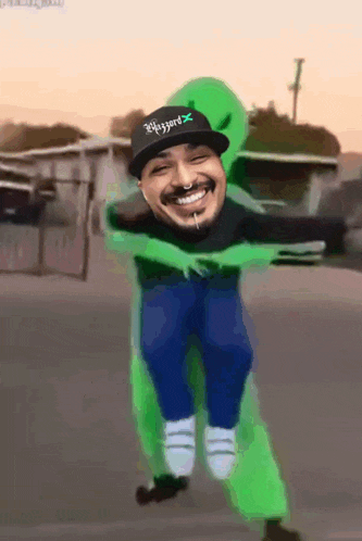 a man wearing a blizzard hat is being carried by a green alien