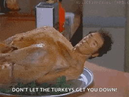 a man is laying on a plate with a turkey on it and the words " don 't let the turkeys get you down "