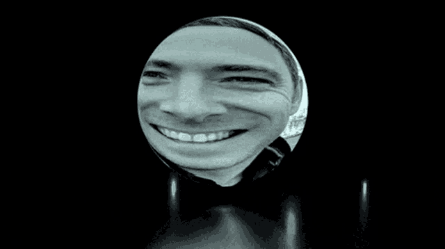 a black and white photo of a city in a glass ball