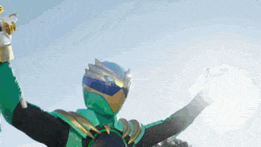 a man in a green and gold costume is holding a sword