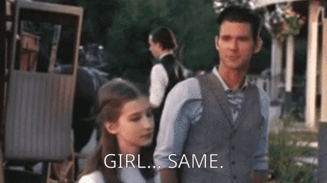 a man and a little girl are standing next to each other and the girl is saying `` girl same '' .