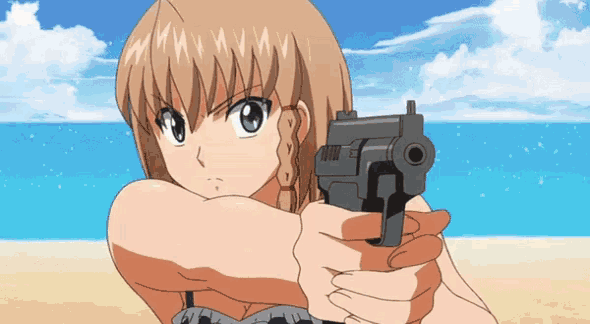 a girl in a bikini is holding a gun in front of the ocean