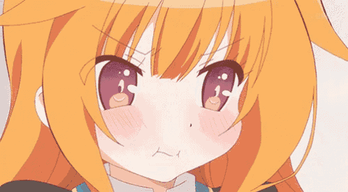 a close up of a girl 's face with orange hair