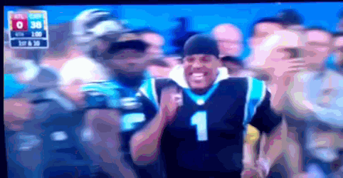 a man wearing a number 1 jersey is dancing in front of a crowd