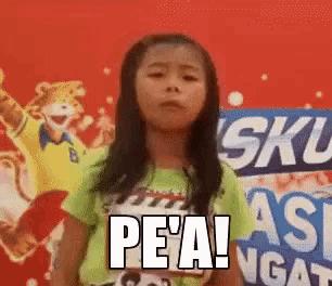 a little girl stands in front of a sign that says sku