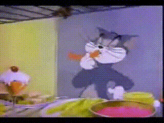 a cartoon of tom eating a carrot with a cupcake behind him