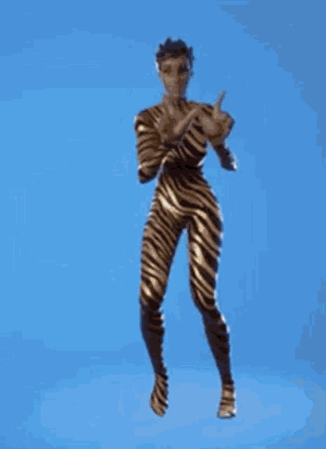 a man in a zebra print bodysuit is dancing .