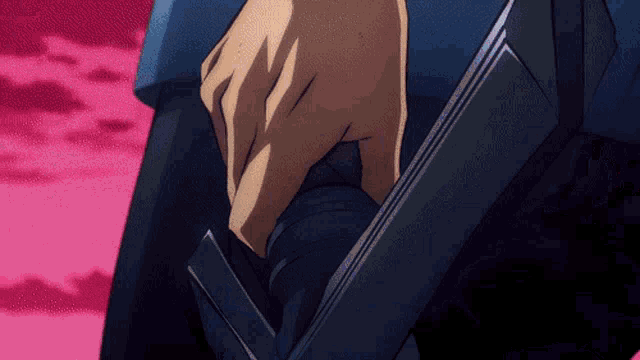 a close up of a person 's hand holding something