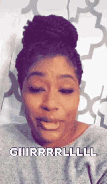 a woman with a bun on her head is making a funny face with the words giiirrrlll written below her