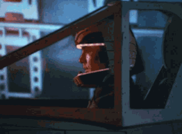 a man in a space suit is looking out of a cockpit window