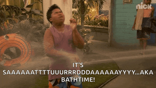 a man is sitting in a pool of water and says it 's bath time .