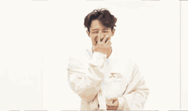a blurry picture of a man wearing a white t-shirt that says ' i love you ' on it