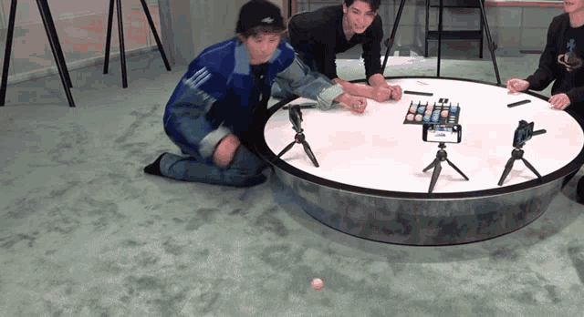 a group of people are playing a game on a table