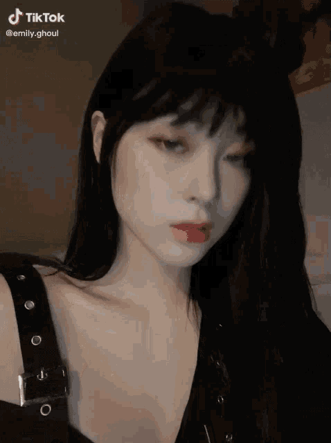 a tiktok video of a woman with black hair