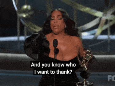 a woman speaking into a microphone with the words and you know who i want to thank below her