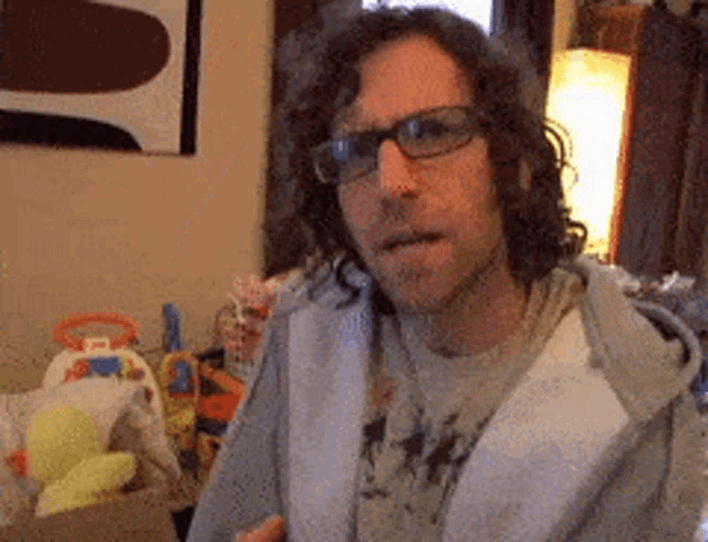 a man wearing glasses and a shirt that says ' i 'm a ' on it