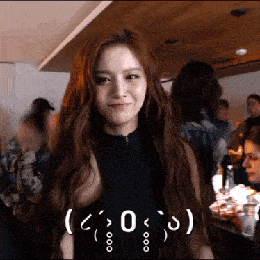 a woman in a black tank top has a smiley face on her face and the number 0 below her