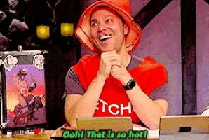 a man wearing a red hat and a shirt that says itch is smiling