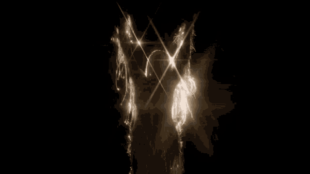 a woman in a white dress with wings is standing in the dark