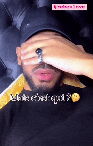 a man with a ring on his finger covering his face and the words mais c'est qui written below him