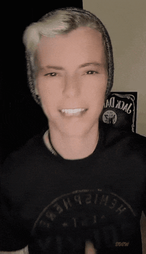 a man wearing a black shirt that says jack daniels on it