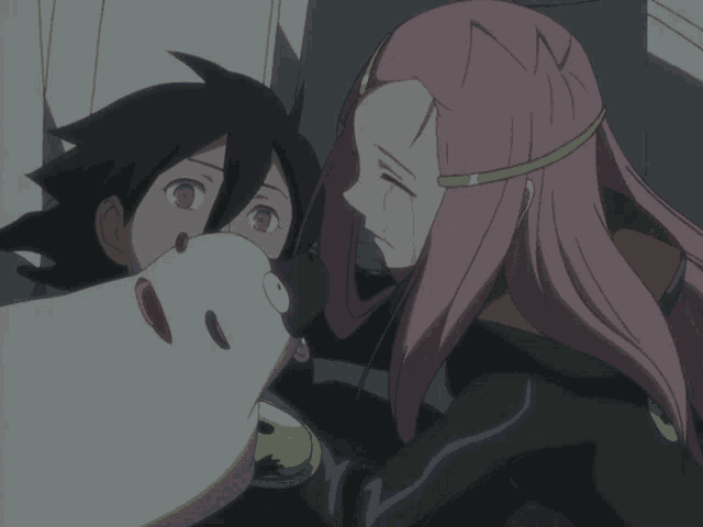 a man and a woman are standing next to each other and the woman has pink hair