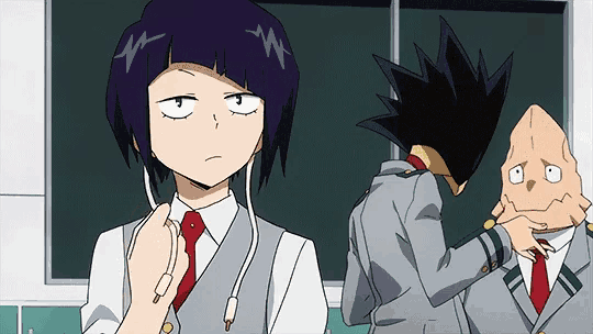 a group of anime characters are standing next to each other in a classroom .