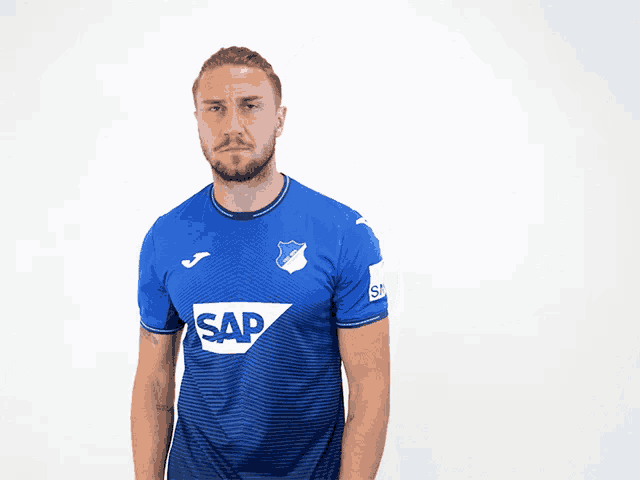 a man wearing a blue shirt that says sap