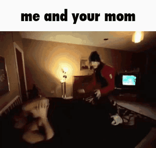 a man is standing in a living room with the words me and your mom written on the bottom