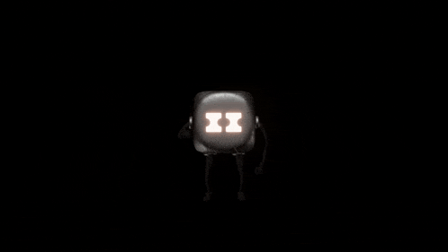 a black dice with green numbers on it is spinning on a black background .