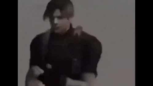 a man in a gas mask is standing in the fog in a dark room .