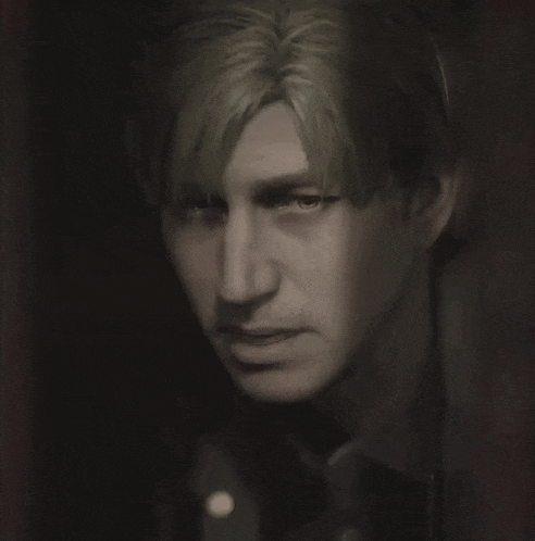 a close up of a person 's face with a dark background