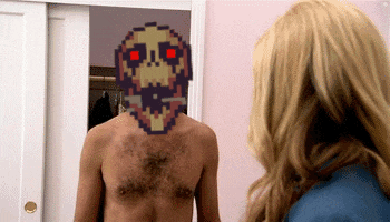 a man without a shirt is looking at himself in a mirror with a pixelated face on his chest