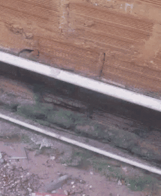 a train is going down the tracks in a blurry photo .