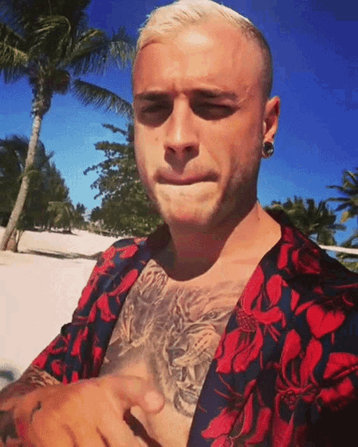 a man with a tiger tattoo on his chest