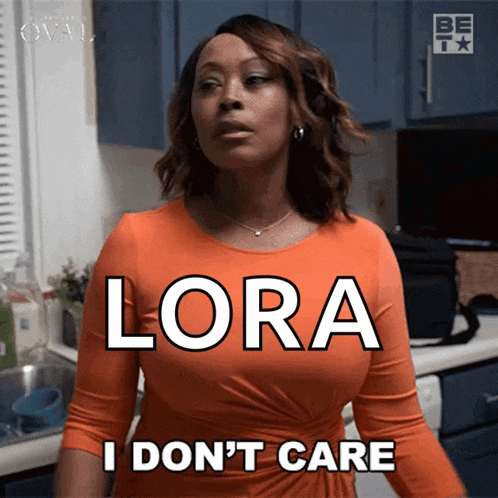a woman in an orange dress has the word lora on her chest