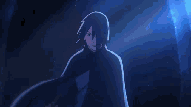 a man in a black cape is holding a blue light