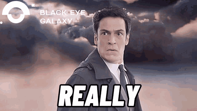 a man in a suit says really in front of a cloudy sky