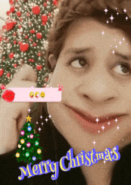 a girl with a christmas tree in the background and the words merry christmas