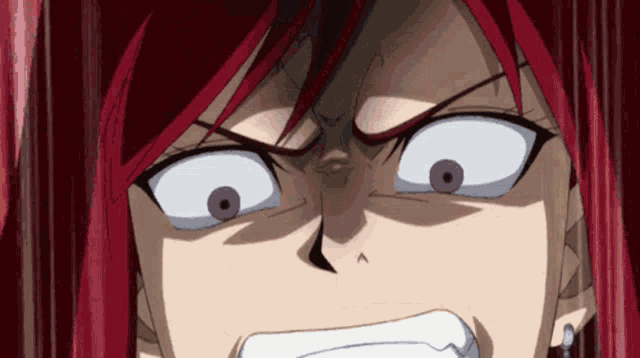 a close up of a woman 's face with red hair and white eyes