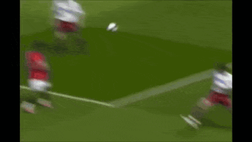 a soccer game is being played in front of an advertisement for season to 60