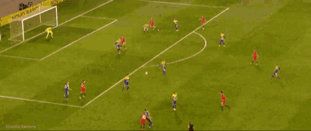 soccer players on a field with an advertisement for novo banco behind them