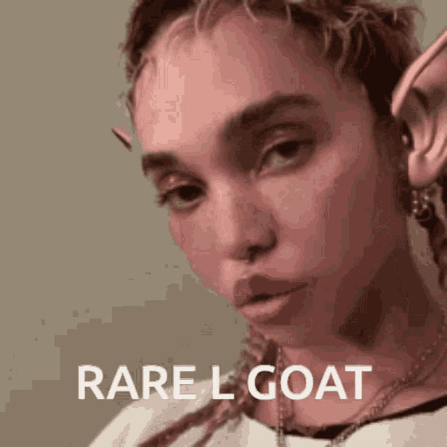 a close up of a woman 's face with the words rare l goat written on it