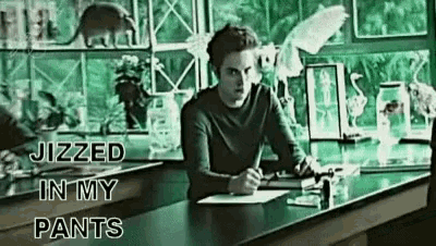 a man sits at a desk with the words " jizzed in my pants " written on the bottom