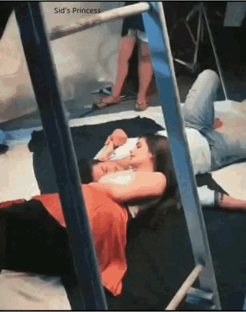 a couple of people laying on a bed with sid 's princess written on the bottom