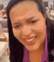 a close up of a woman 's face with a smile on her face .
