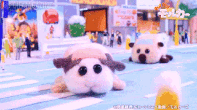 two stuffed animals are walking down a street in front of a sign that says ' tokyo ' on it